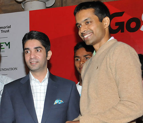 Ace shooter Abhinav Bindra (left) with former badminton player Pullela Gopichand during a function in  the City on Wednesday. DH PHOTO
