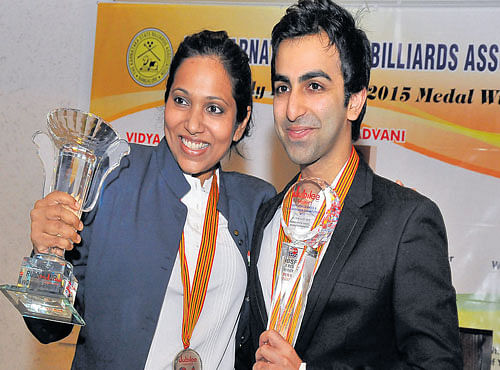 HAPPY TIMES: Vidya Pillai (left) and Pankaj Advani were felicitated for their recent victories by the Karnataka State Billiards Association on Monday. DH PHOTO