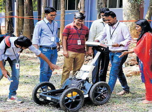 Visitors take a look at the Ground Penetration Radar conceived by the Department of Civil Engineering. DH PHOTO
