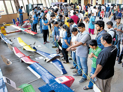 The IISc already has an annual Open Day, during which  visitors get to see around the campus. Science enthusiasts look at models of aircraft displayed by the Aerospace  Engineering department during the event organised in May this year. dh FILE&#8200;Photo