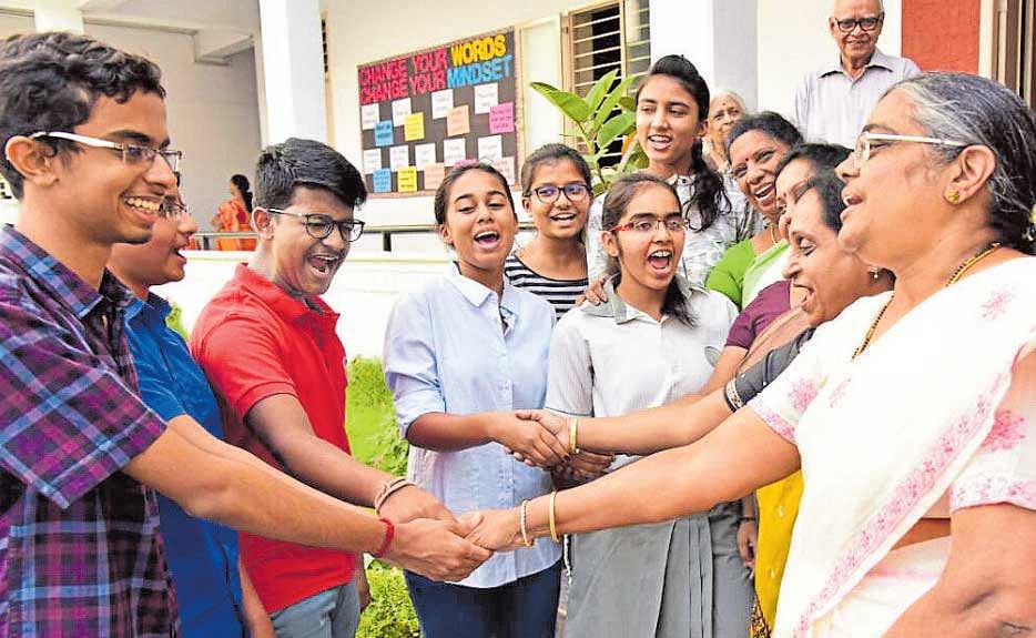 Teachers of Regency Public School, Bengaluru, congratulate their students after ICSE&#8200;results were announced on Monday.