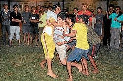 Players slugging it out at a Kabbadi Match held at Mens Hostel of the Mysore Medical College and Research Institute (MMC and RI) in Mysore on Wednesday. DH photo