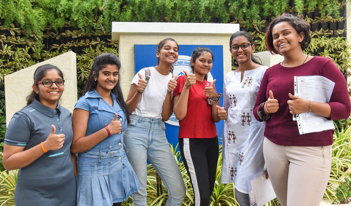 Riya Sen, Mehek Fathima, Aprita Shriya and friends celebrate their achievement in Class X result at Baldwin Girls High School, Richmond Road in Bengaluru on Tuesday. DH Photo by S K Dinesh
