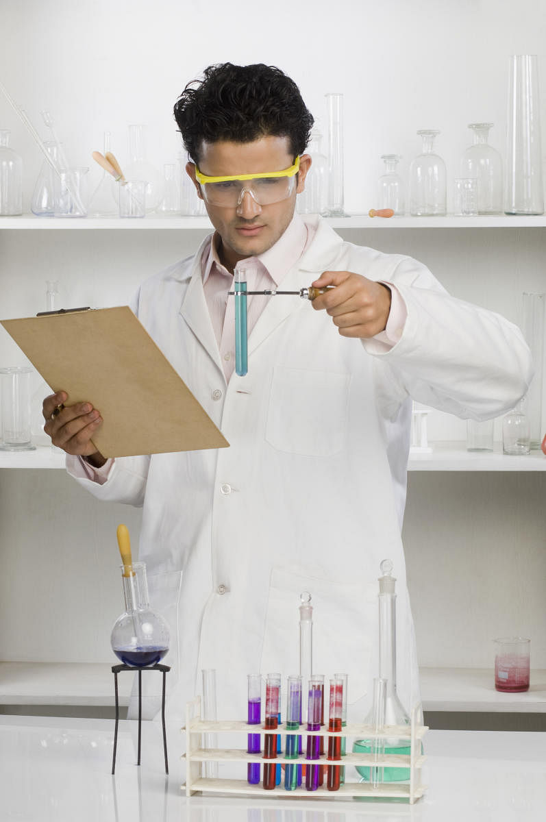 Scientist experimenting in a laboratoryScientist experimenting in a laboratory