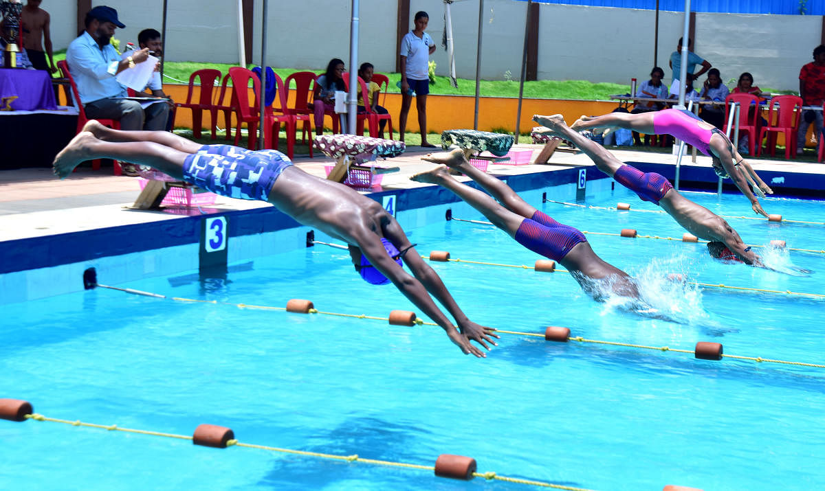 Children in action at the district-level swimming competition organised by Jai Hindu Swimming Club and DK district Swimming Association, at Mangala Swimming pool, in Mangaluru on Saturday.
