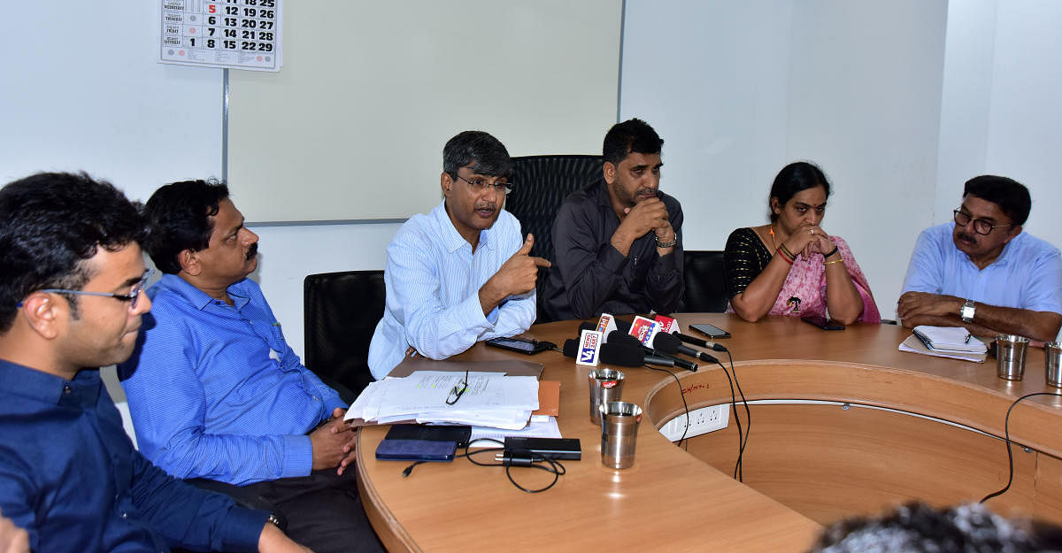 Senior physician Dr Srinivasa Kakkillaya speaks at a press meet at Mangaluru City Corporation on Monday.
