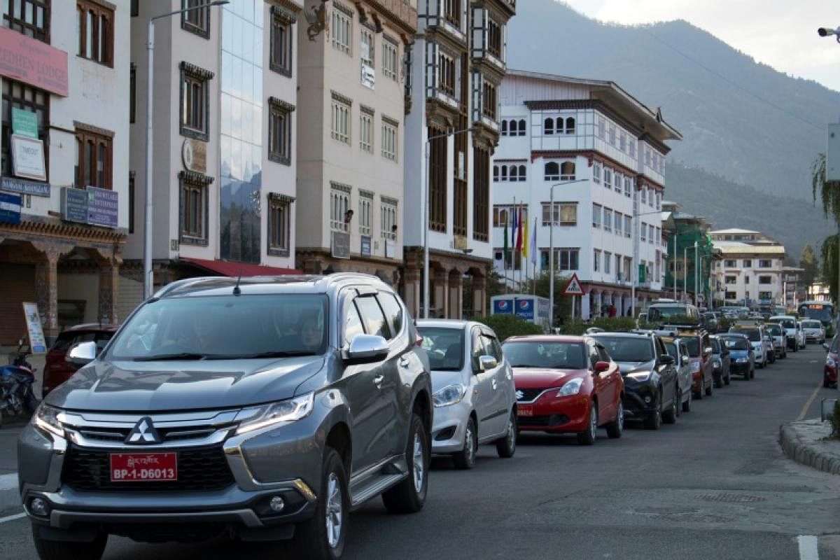 Famed for valuing Gross National Happiness over economic growth, Bhutan is a poster child for sustainable development. But booming car sales may impact efforts to preserve its rare status as a carbon-negative country and an increase in traffic is testing the good humour of its citizens. (AFP Photo)