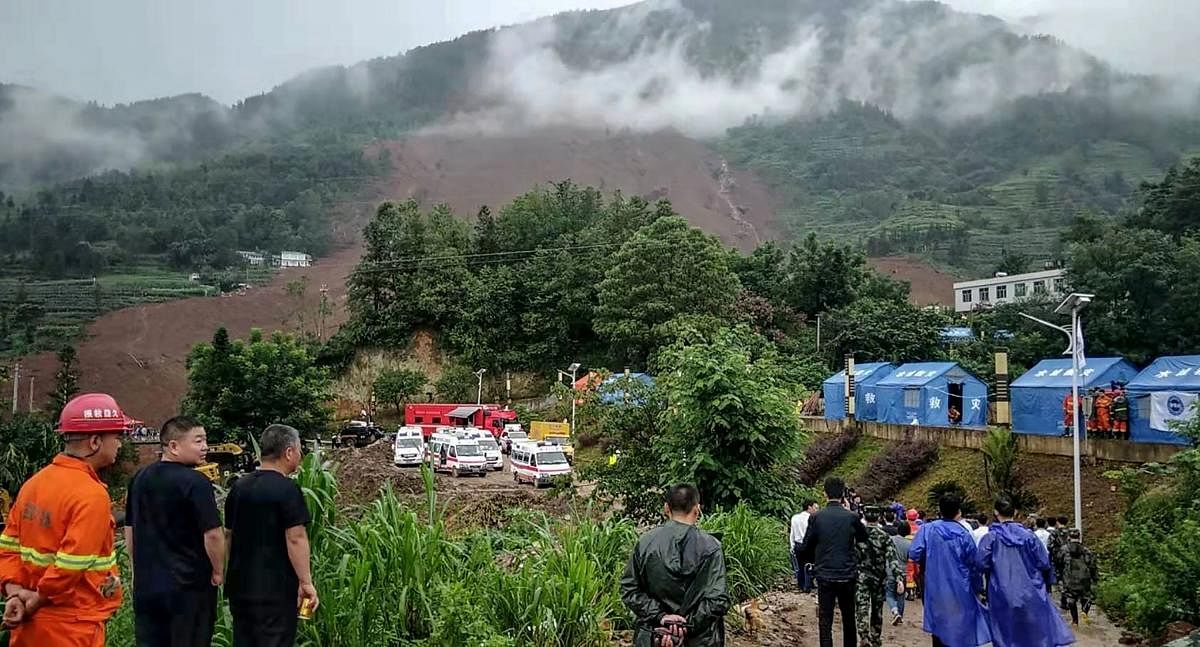 Rescuers gather at the site of a landslide in Liupanshui in China's southwestern Guizhou province on July 24, 2019. Photo credit: AFP