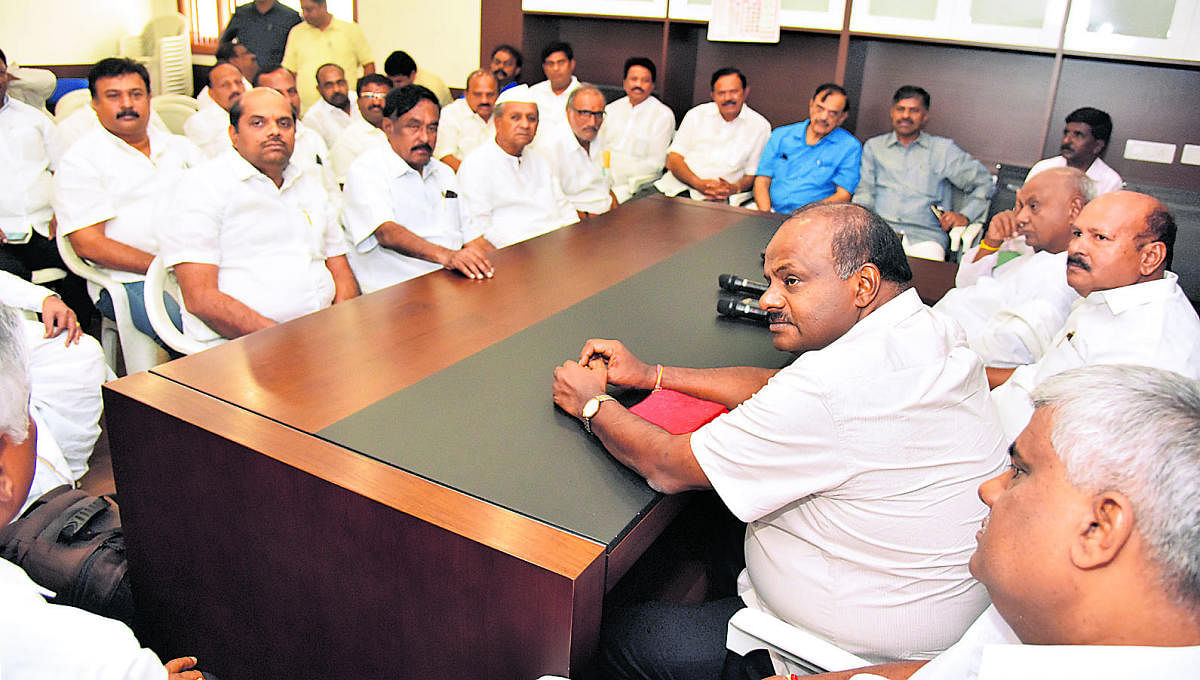 Former minister H D Revanna, caretaker Chief Minister H D Kumaraswamy, JD(S) working president H K Kumaraswamy and former prime minister H D Devegowda and others take part in JDS legislature party meeting in Bengaluru on Wednesday. (DH Photo)