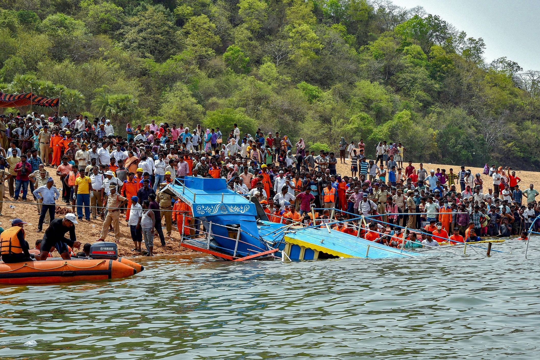 Rescue teams carry out operations after an open motor boat carrying 40 people capsized in Godavari river in East Godavari district on Wednesday. PTI 