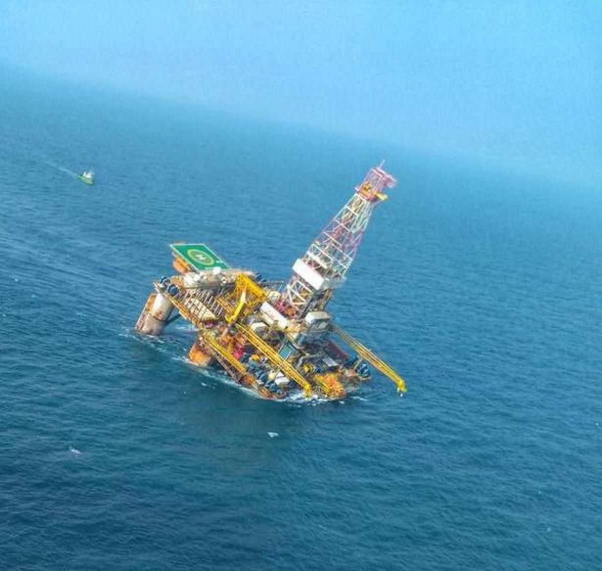 The tilted deck of the ONGC oil rig in the Bay of Bengal off Andhra Pradesh coast. Photo: Twitter/@indiannavy