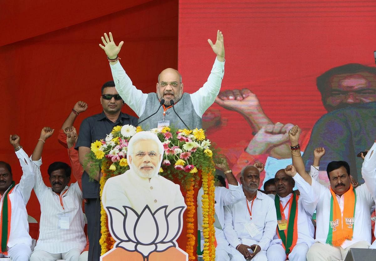 BJP National President Amit Shah addresses an election rally in support of party candidate at Shamshabad on the outskirts of Hyderabad on Tuesday. PTI photo