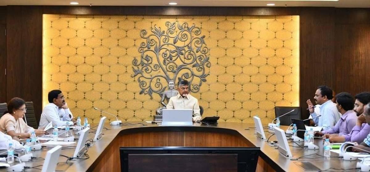 Andhra Pradesh CM Nara Chandrababu Naidu reviewing the works in the state capital on Thursday at his official residence in Amaravati. DH PHOTO
