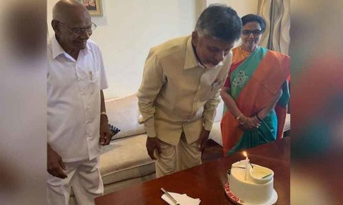 Naidu cutting cake in Hyderabad residence on Saturday