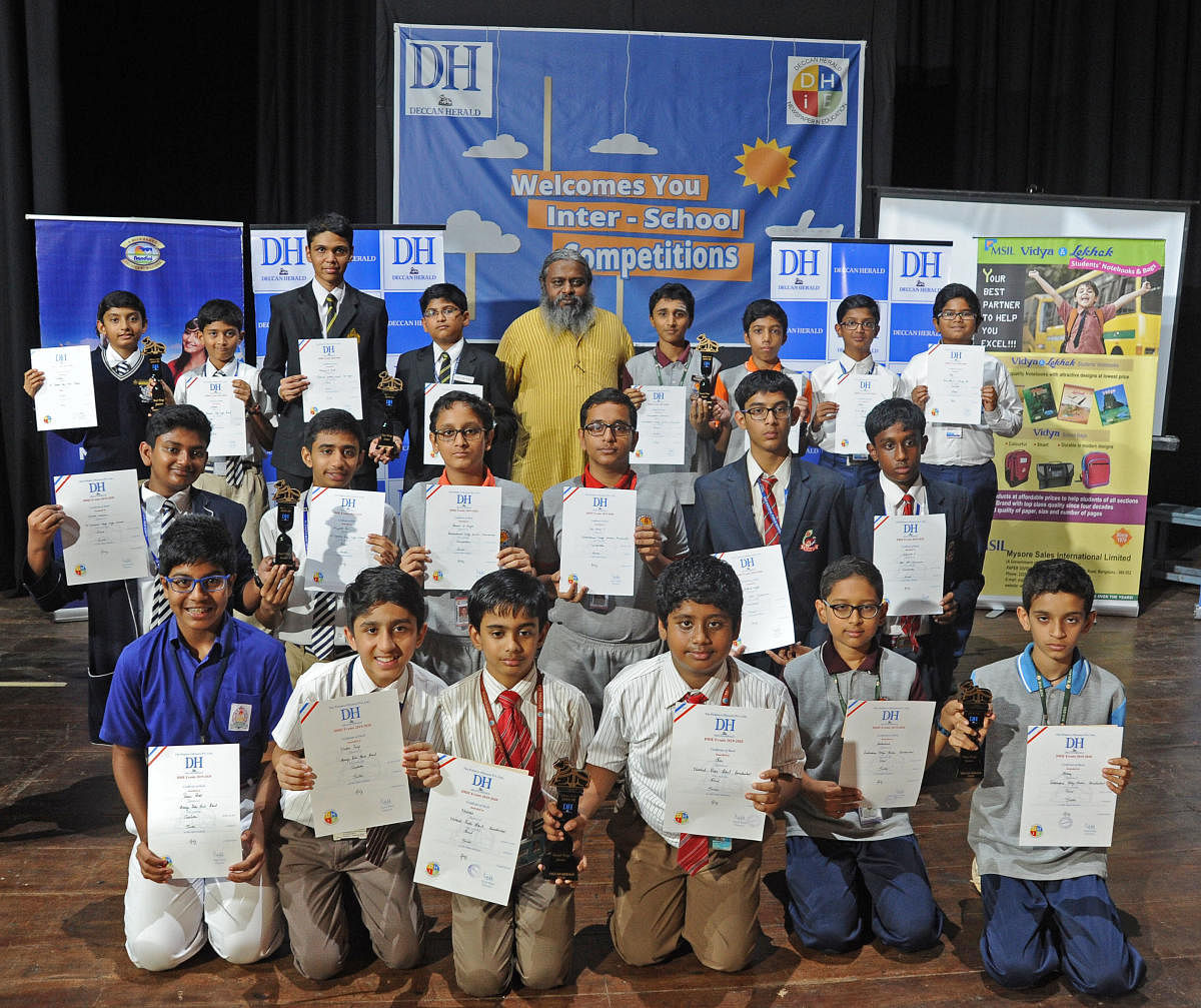 Winners of the DH quiz competition with quiz master Dr Arul Mani on Wednesday. Sitting, L-R: (Junior) Consolation winners Pranav Diddi and Nandan Parigi; 2nd Shiv and Neeladri; 3rd Aashuthosh and Akshay.2nd row, L-R: (Senior) 3rd Shlok Charan and Aviyakt