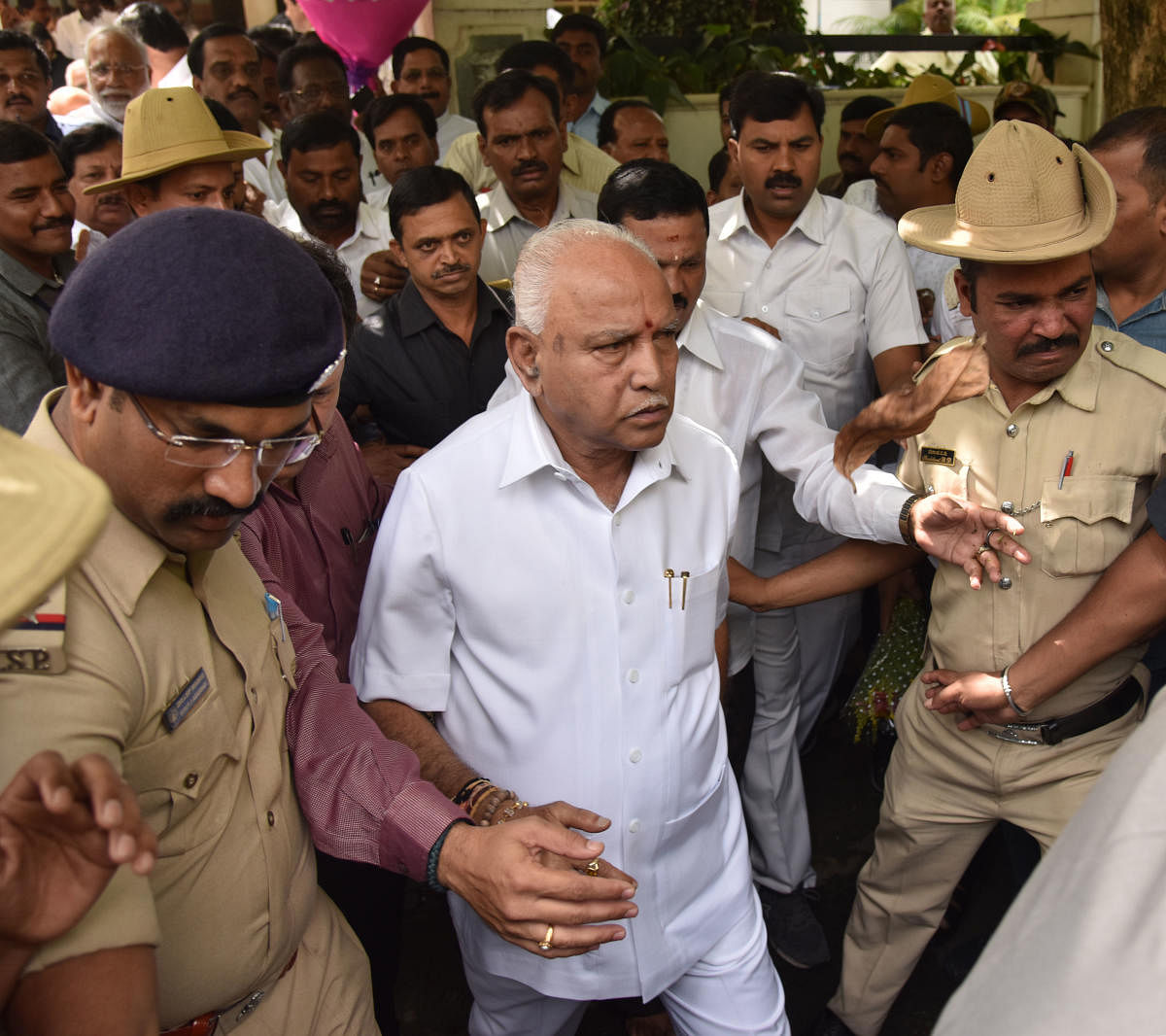State BJP president B S Yeddyurappa comes out of his house in Bengaluru on Wednesday. (DH Photo/Janardhan B K)