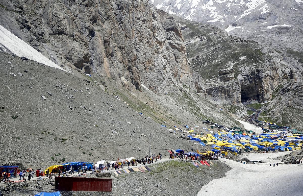 Hindu devotees on their way to the holy cave shrine of Amarnath, at Pahalgam in Anantnag district of Jammu and Kashmir, Wednesday, July 17, 2019. (PTI Photo)