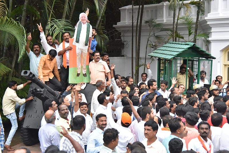 upporters in front of Raj Bhavan during Chief Minister Designated B S Yediyurappa taking vote ceremony in Bengaluru.