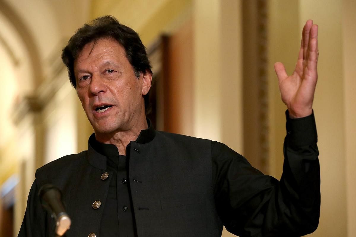 A controversy has erupted over Pakistan Prime Minister Imran Khan's outfit which he wore during his meeting with US President Donald Trump after a luxury designer claimed that it was his creation. (AFP Photo)