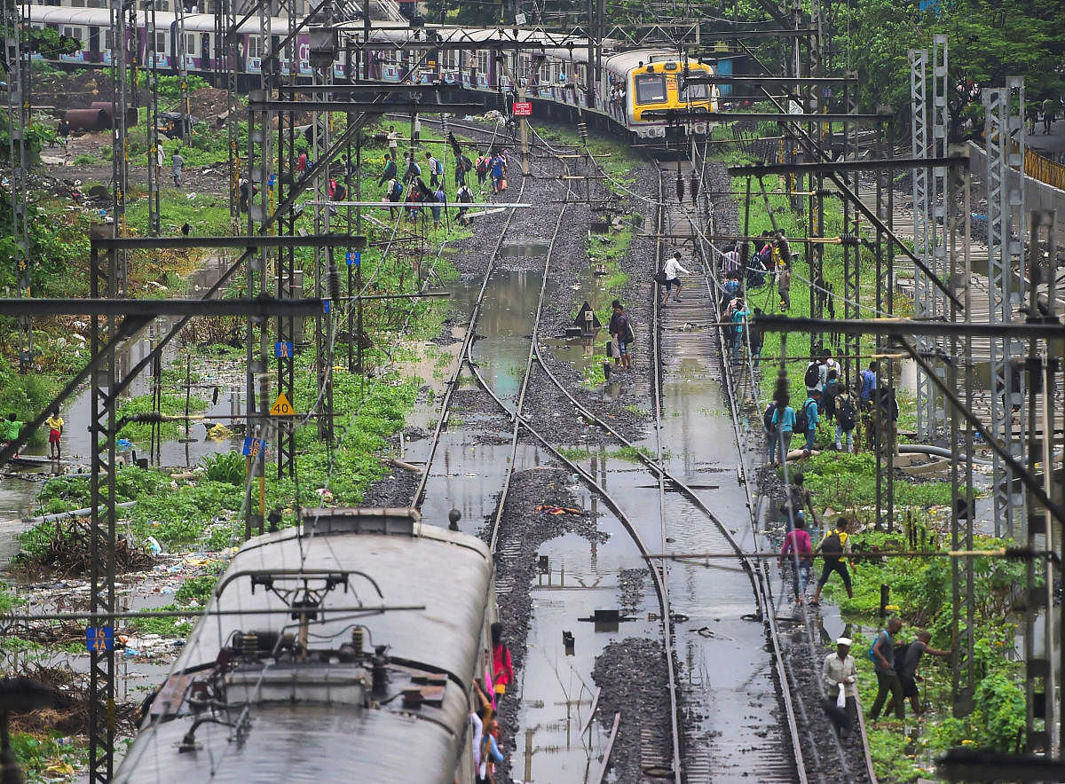 In an unprecedented measure, the Maharashtra government on Saturday requested the defence officials to arrange airlift of passengers of a train stuck on tracks near Mumbai since Friday night. (PTI Photo)