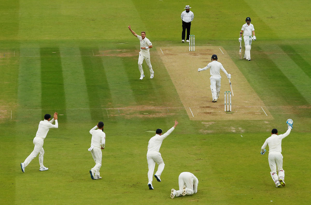 England's Stuart Broad celebrates taking the wicket of Ireland's Andy McBrine after England's Joe Root takes the catch. Photo credit: Reuters