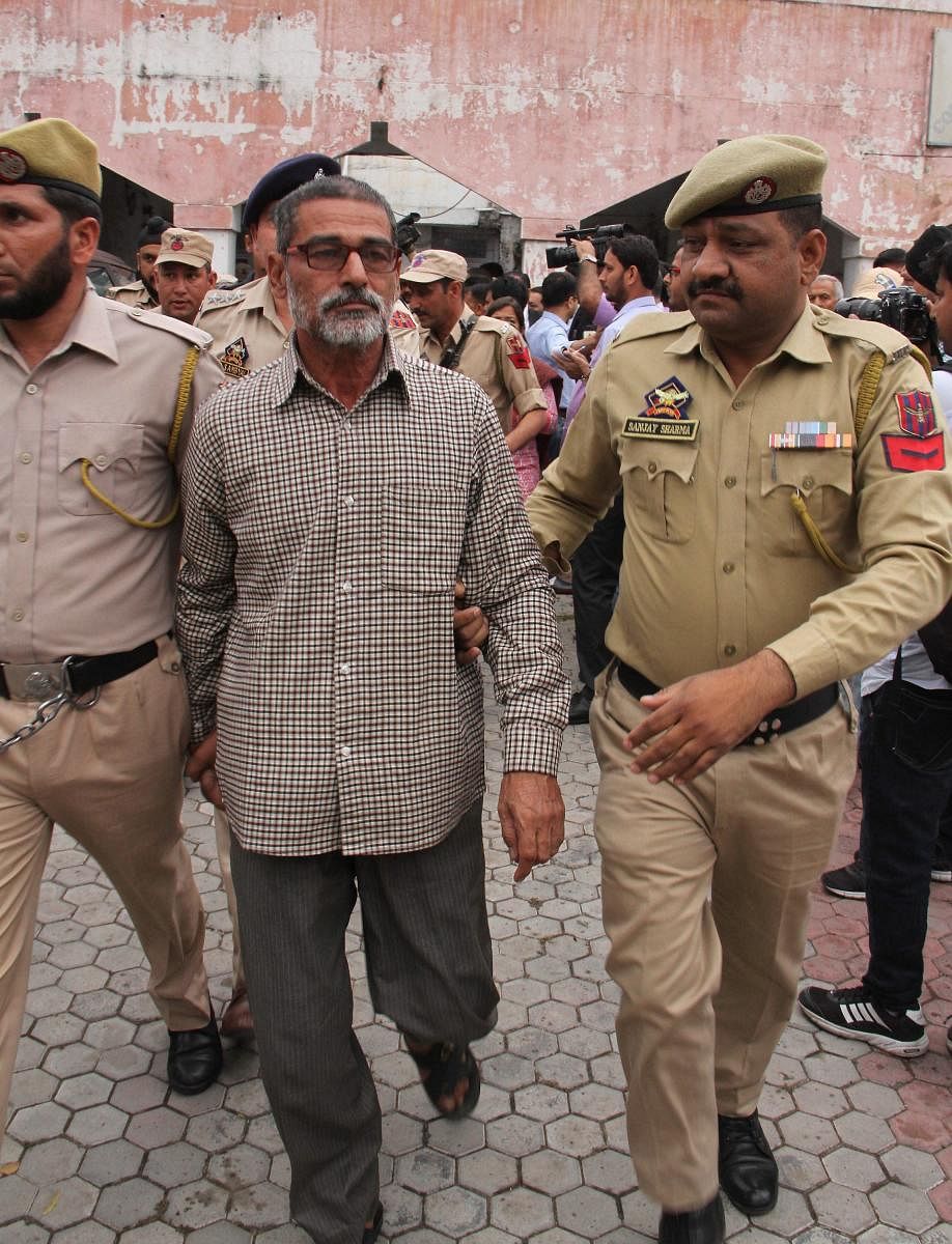 Sanji Ram, the main accused in Kathua rape and murder case, being produced in District Court in Kathua, about 85km from Jammu on Monday. (PTI Photo)