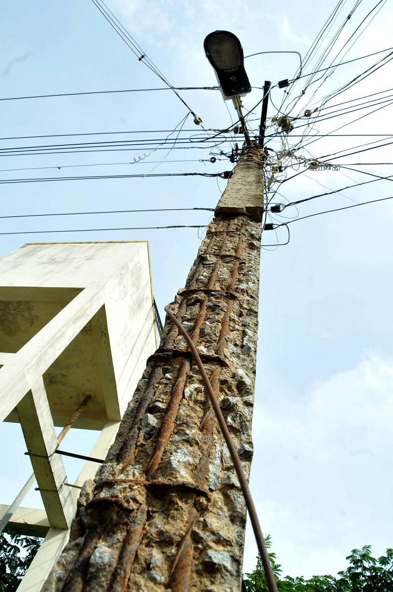 An electricity pole behind the District Ayush Hospital at Azad Park Circle in Chikkamagaluru is in a dilapidated condition.