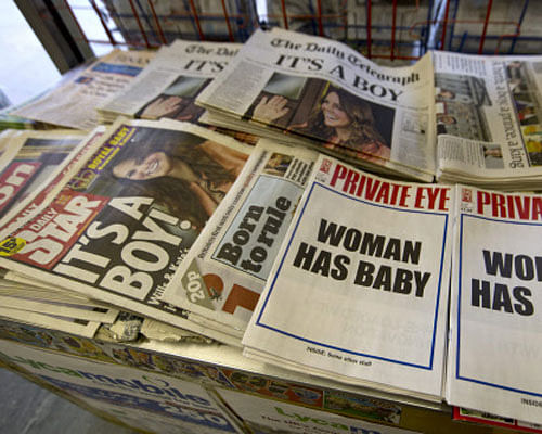 A Private Eye magazine is seen in a newsagents shop in Notting Hill in London July 23, 2013. The world was awaiting the first glimpse of Britain's new prince on Tuesday, with camera crews poised to photograph Britain's Prince William and his wife, Catherine, Duchess of Cambridge leaving the Lindo Wing of St Mary's Hospital with their baby son. Kate gave birth to the couple's first child, who is third in line to the British throne, on Monday afternoon, ending weeks of feverish anticipation about the arrival of the royal baby. REUTERS