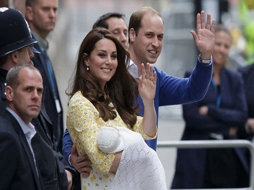Britain's Prince William and Kate, Duchess of Cambridge with their newborn baby, Princess Charlotte Elizabeth Diana, waving to the public as they leave St. Mary's Hospital's exclusive Lindo Wing in London. AP photo