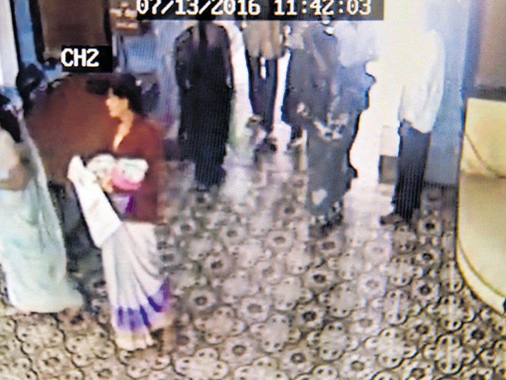 A CCTV footage of the woman with the baby at Vani Vilas Hospital on July 13.