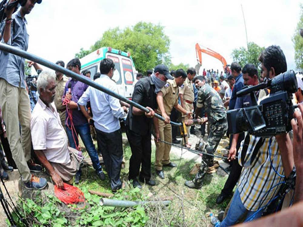 The National Disaster Response Force (NDRF) team of experts who were on the job from the midnight of Thursday have finally given up their efforts as the child has slipped and fallen into the deep hole, said to be 200 feet deep. Their efforts to retrieve the child with a robotic arm, along with the submersible pump on which she fell and hurt herself, failed as only the pump with blood stains has come out. Deccan Herald photo