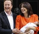 Britain's Prime Minister David Cameron stands with his wife Samantha outside Number 10 Downing Street as they present their new baby daughter Florence Rose Endellion to media, London September 3, 2010 REUTERS/Stefan