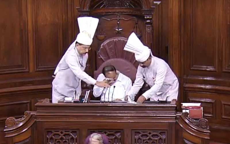 Rajya Sabha chairman M Venkaiah Naidu wipes out his tears after the House paid homage to Jaipal Reddy. (Video Grab/RSTV)