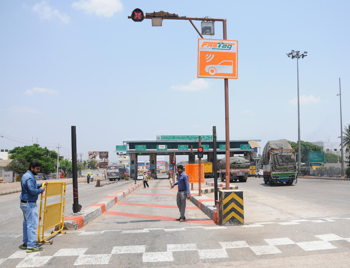 All the entry and exit lanes at the toll plazas have been converted into hybrid lanes by installing the equipment needed to read FASTag. But, a majority of vehicle owners are yet to instal the necessary device on their vehicles. dh file photo