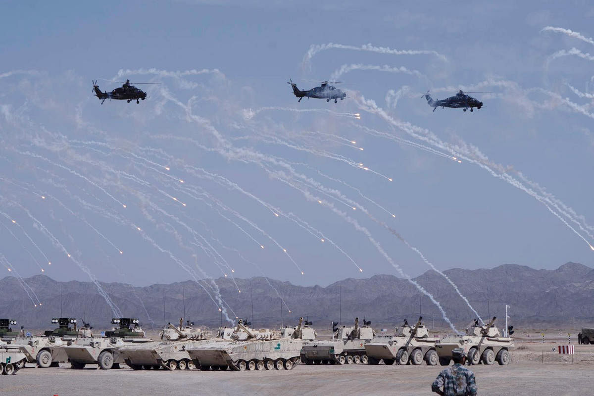 Helicopters and tanks perform during the opening ceremony of three games hosted by PLA part of International Army Games (Reuters File Photo)