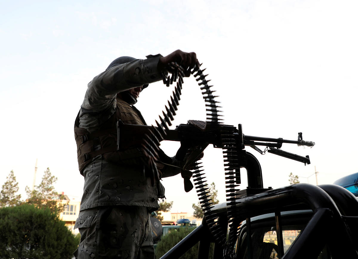 A member of Afghan security forces loads a machine gun near the site of a powerful blast in Kabul, Afghanistan July 28, 2019. REUTERS/Omar Sobhani