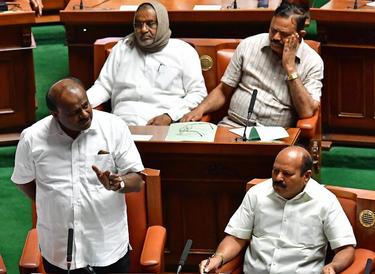 Former chief minister H D Kumaraswamy speaks at the Assembly session in Vidhana Soudha, Bengaluru on Monday. MLAs H K Kumaraswamy, A T Ramaswamy and former minister G T Devegowda are seen. DH Photo