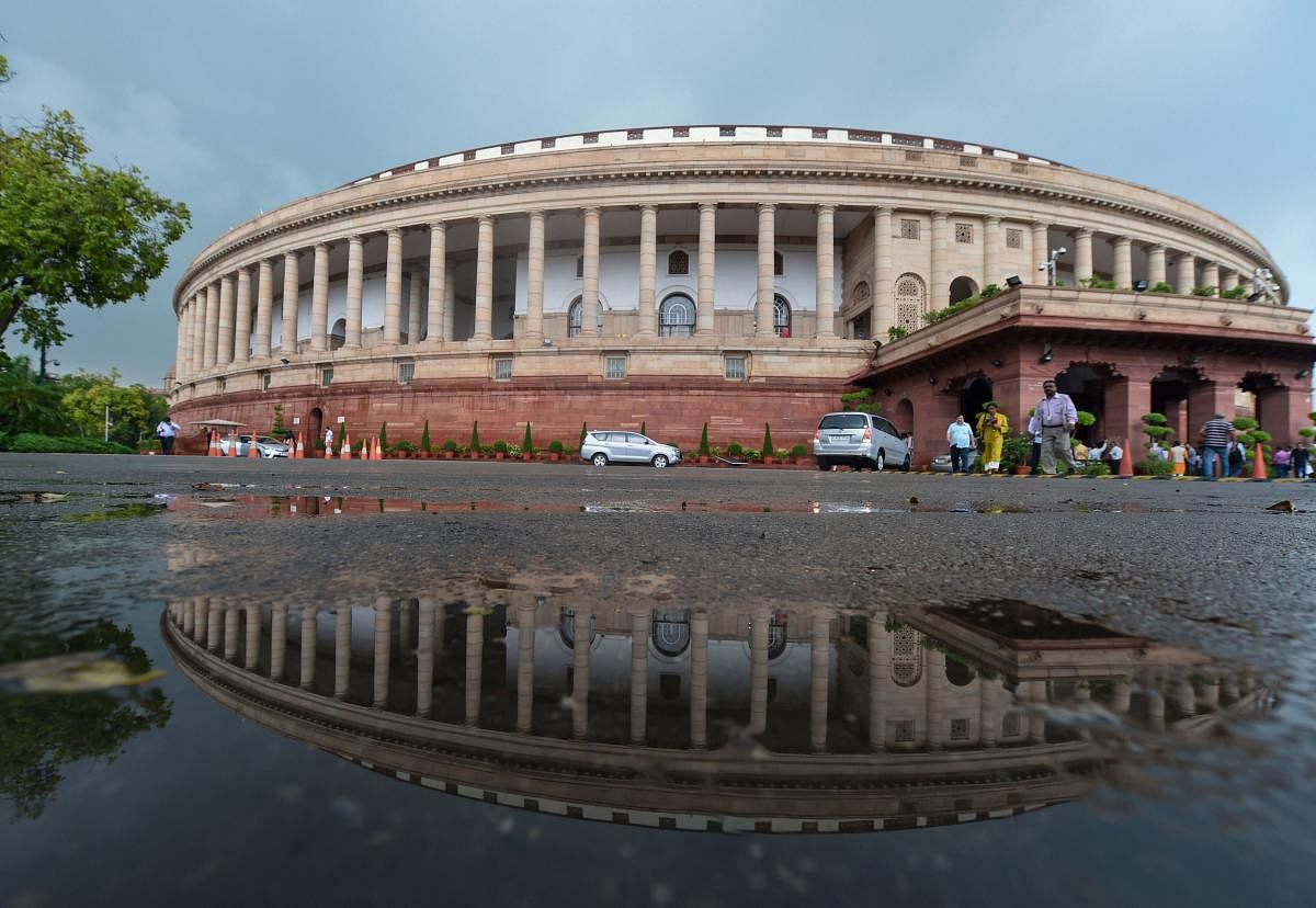 A view of the Parliament House following monsoon rainfall, in New Delhi. PTI