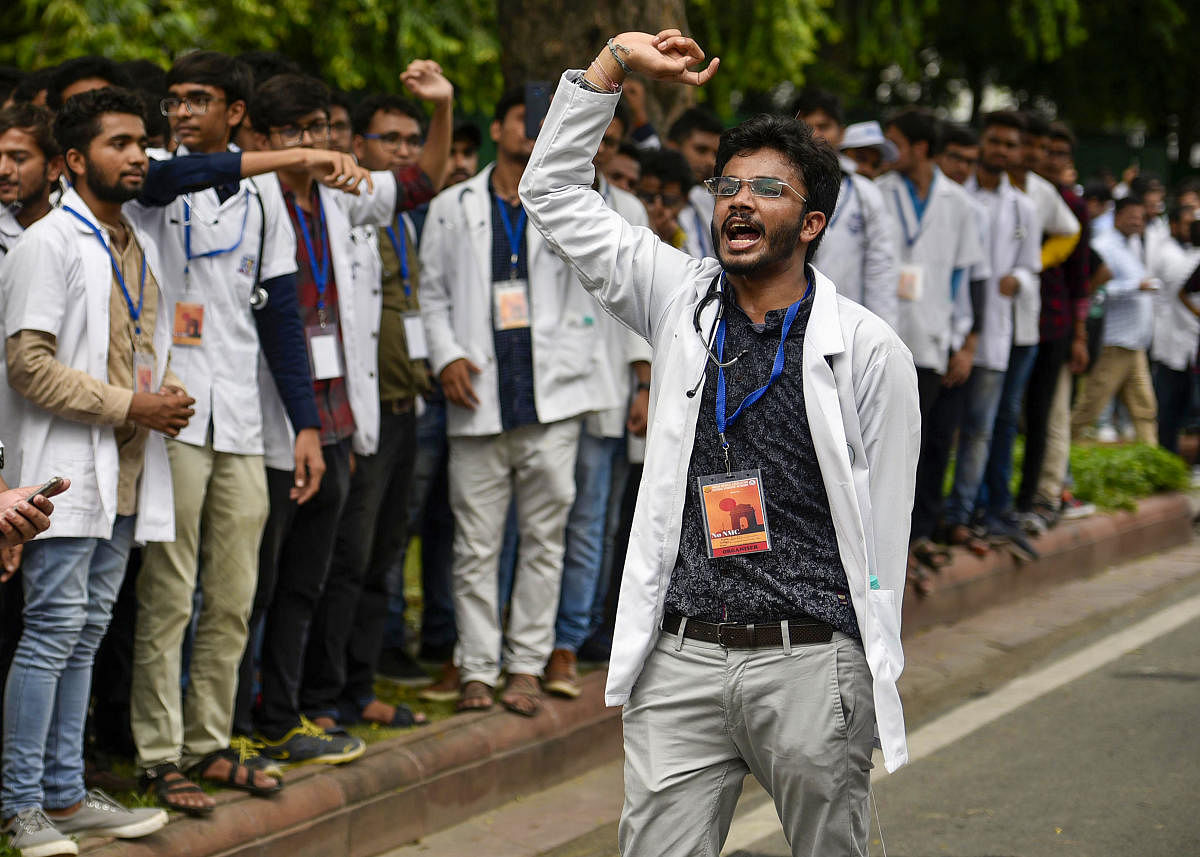  Doctors and students from Indian Medical Association (IMA) shout slogans as they stage a protest against the National Medical Commission Bill (NMC). (PTI Photo)