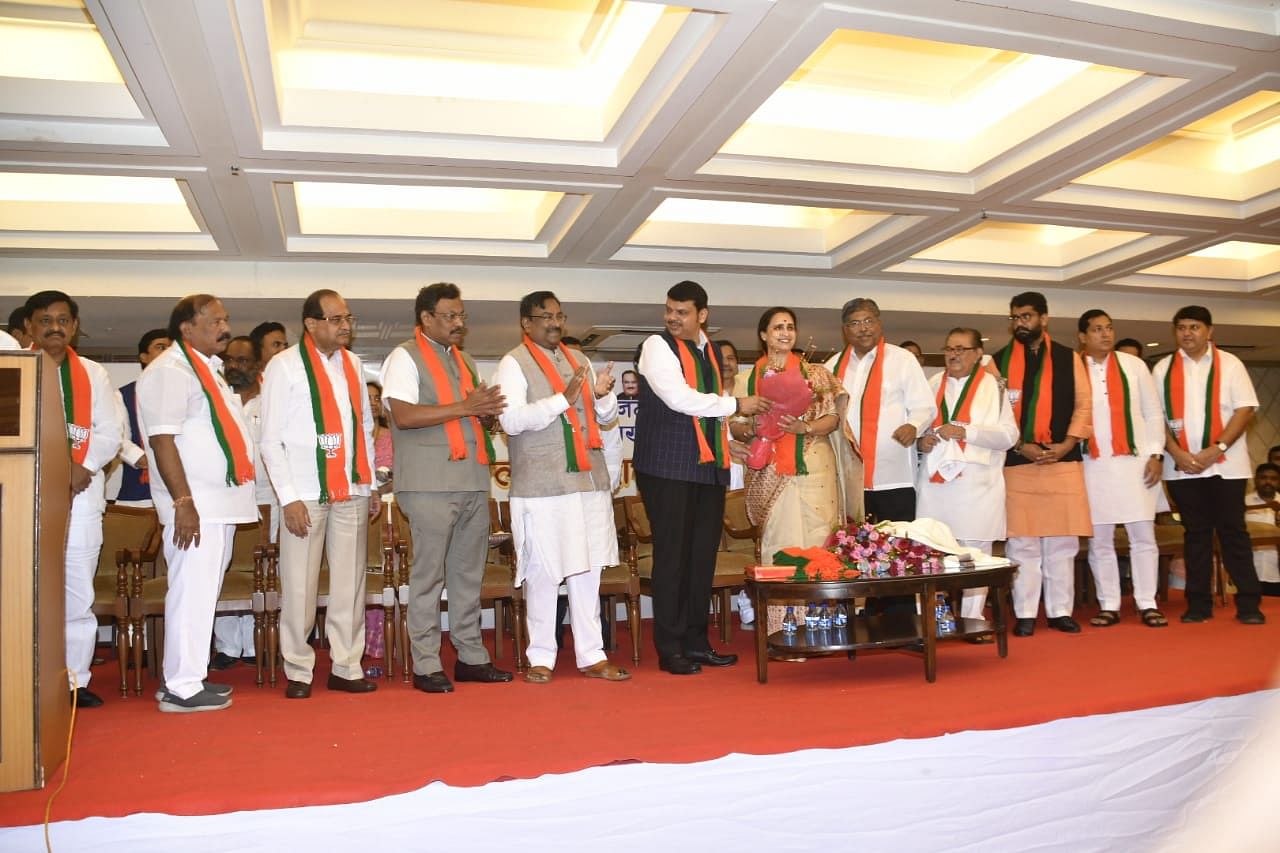 Four MLAs are - Shivendraraje Bhosale, Vaibhav Pichad and Sandeep Naik (all from NCP) and Congressman Kalidas Kolambkar - join BJP in an event attended by chief minister Devendra Fadnavis.