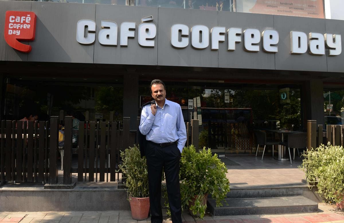 V G Siddhartha, owner of the Café Coffee Day chain, poses for a photograph at one of his coffee shops in Ahmedabad. (AFP File Photo)