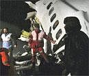 Rescue workers attend the scene after an IranAir Boeing 727 passenger plane crashed as it was making an emergency landing, outside the city of Orumiyeh, 460 miles (700 kilometers) northwest of the capital, Tehran, Iran, Sunday, Jan. 9, 2011. AP