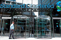 in trouble : Britain's bank sector suffered a fresh heavy blow on Tuesday as Standard Chartered's market value slumped as much as a quarter after US regulators alleged it hid $250 billion in transactions with Iran. NYT