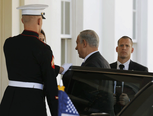 Israeli Prime Minister Benjamin Netanyahu (C) arrives at the White House before meeting with U.S. President Barack Obama in the Oval Office, September 30, 2013. REUTERS