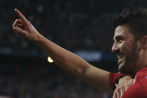 David Villa, former Valencia, Barcelona, and Atletico Madrid player, announced Monday that he will retire from international football after the 2014 World Cup in Brazil. AP file photo