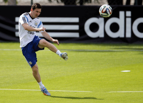 Argentina's national team player Lionel Messi kicks a ball during a training session at Ciudad do Galo grounds in Vespasiano, outside Belo Horizonte. Reuters photo