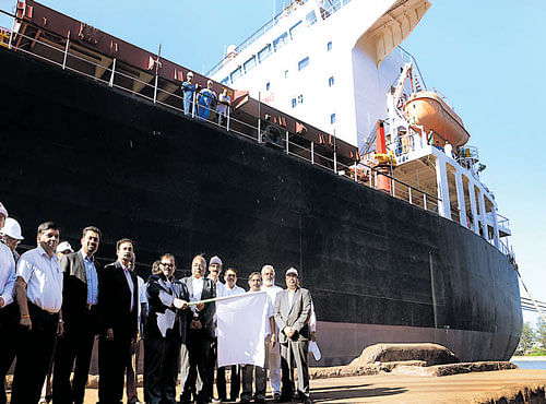 KIOCLC MD Malay Chatterjee flags off loading of high grade iron ore pellets at New Mangalore Port. DH PHOTO