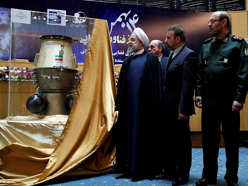 President Hassan Rouhani, left, visits an exhibition of Iran's latest achievements of space technology, in Tehran, Iran, Wednesday, Feb. 1, 2017.Minister of Communications and Information Technology Mahmoud Vaezi, center, and Defense Minister Hossein Dehghan accompany Rouhani. AP/PTI Photo