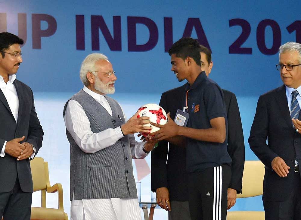 Prime Minister Narendra Modi with Sports Minister Rajyavardhan Singh Rathore at the opening ceremony of FIFA U-17 World Cup 2017 at Jawaharlal Nehru Stadium in New Delhi on Friday. PTI Photo