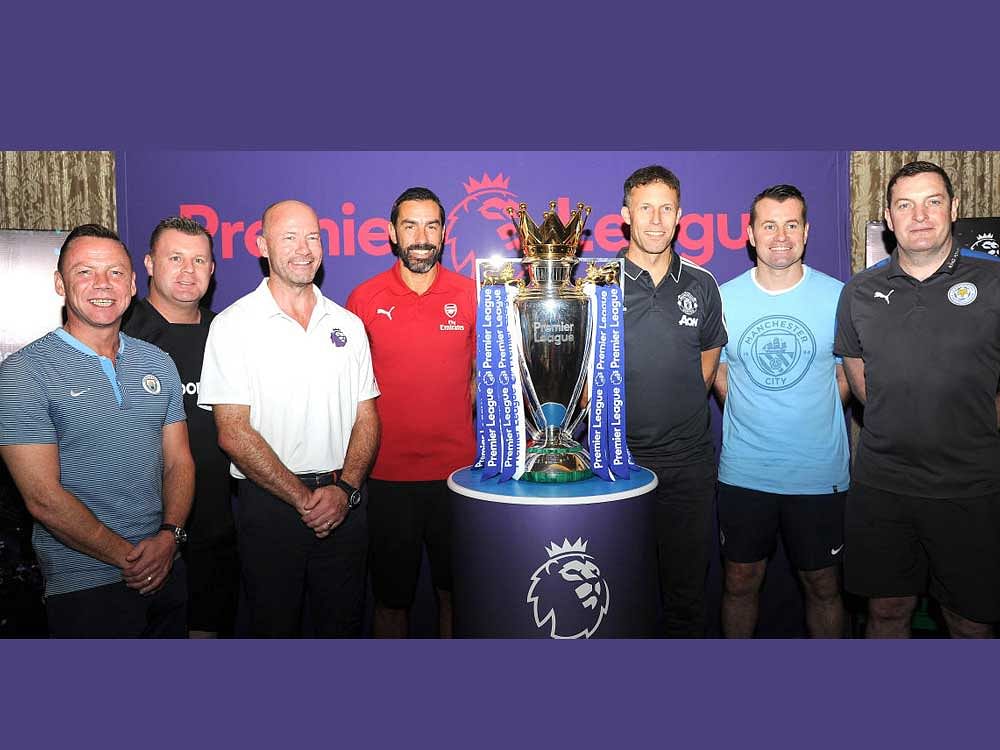 (From left) Paul Dickov (Manchester City), Graham Stuart (Everton), Alan Shearer (Newcastle United), Robert Pires (Arsenal), Ronny Johnsen (Manchester United), Shay Given (Manchester City) and Gerry Taggart (Leicester City) pose with the Premier League trophy on on Friday. DH Photo/ Srikanta Sharma R